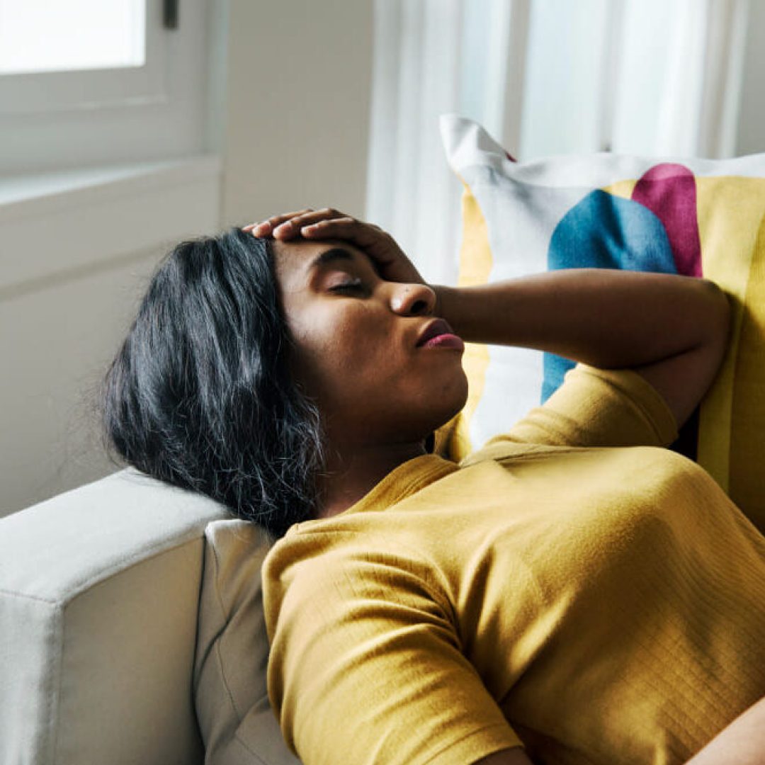 black-woman-headache-sleeping